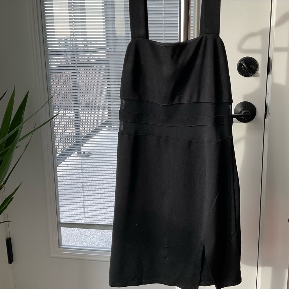 Step out in confidence with this stunning black dress.